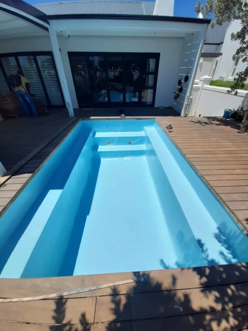 A deck pool, from green to bright blue
